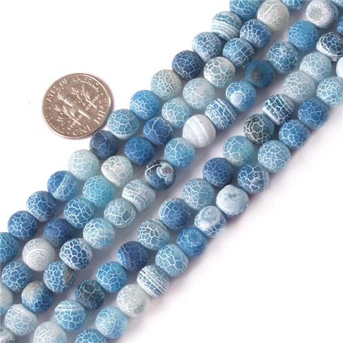 Five strands of beads in varying shades of blue and white with a cracked ice texture.  There is an American dime nearby for size comparison.