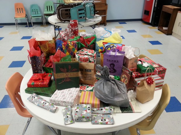A table full of wrapped gifts.