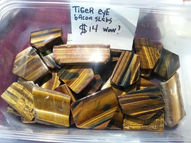 Rectangular slabs of brown and yellow tiger's eye that resemble bacon.