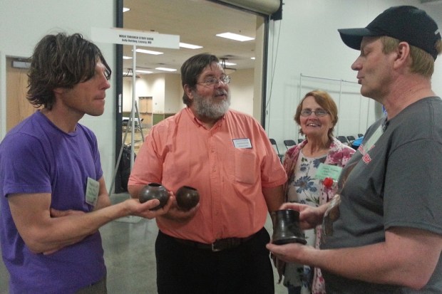 Four Show-Me Rockhounds members discussing pottery.