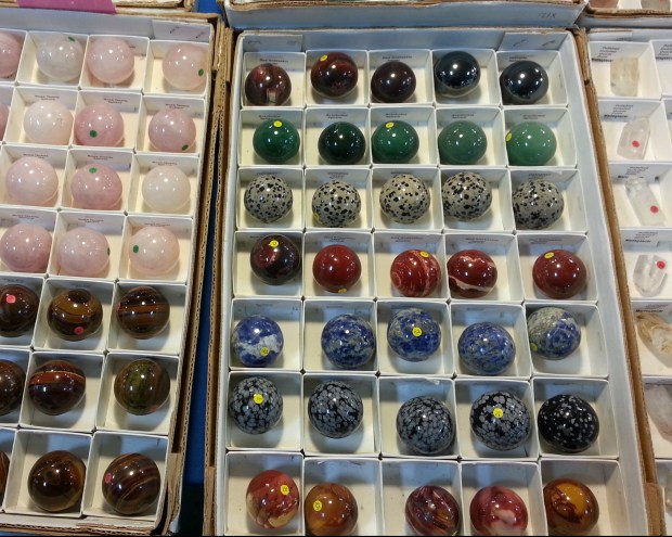 Mineral spheres of assorted colors red green blue pink orange