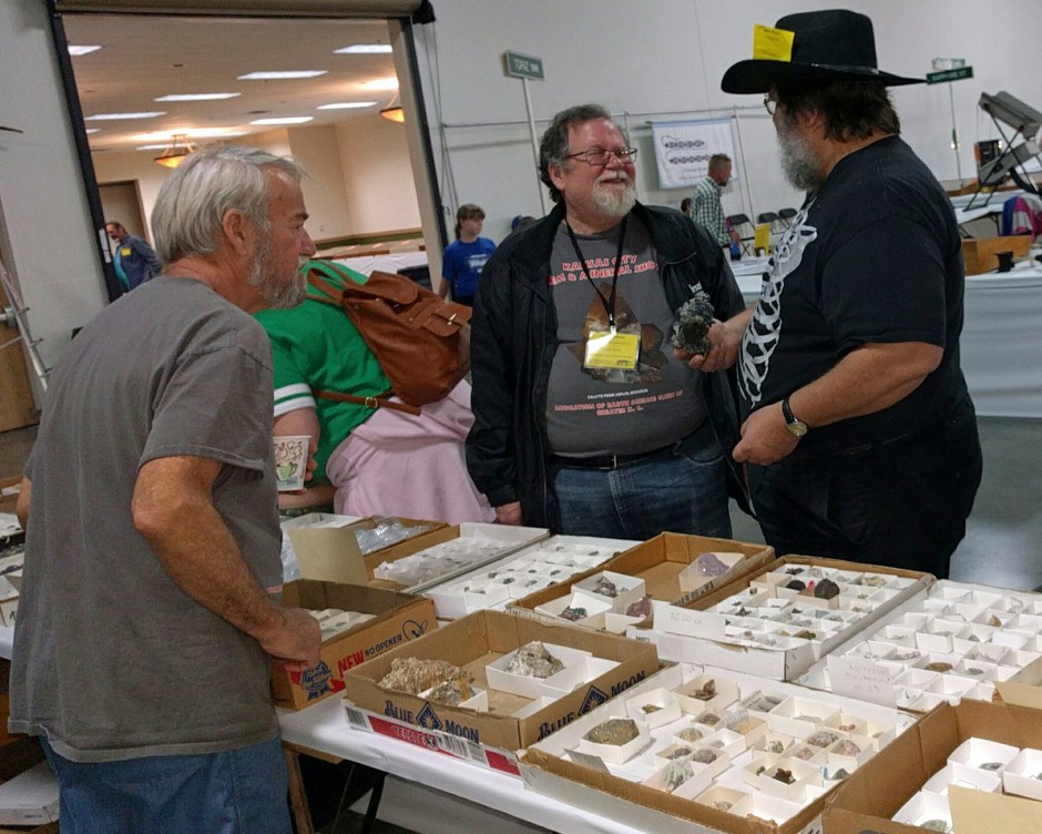 People buying and selling rocks