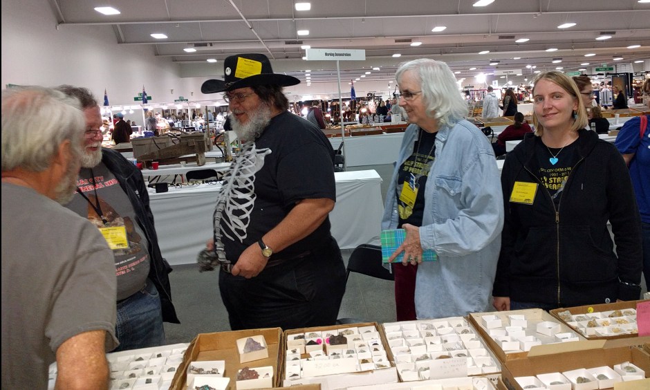 People buying and selling rocks