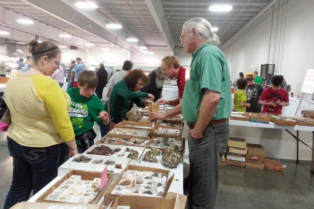 People buying and selling rocks