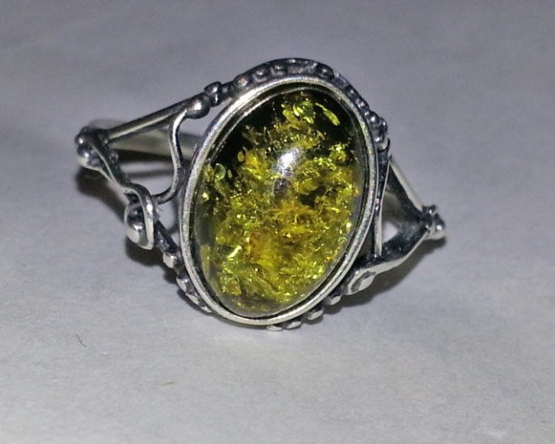 silver ring with oval green amber