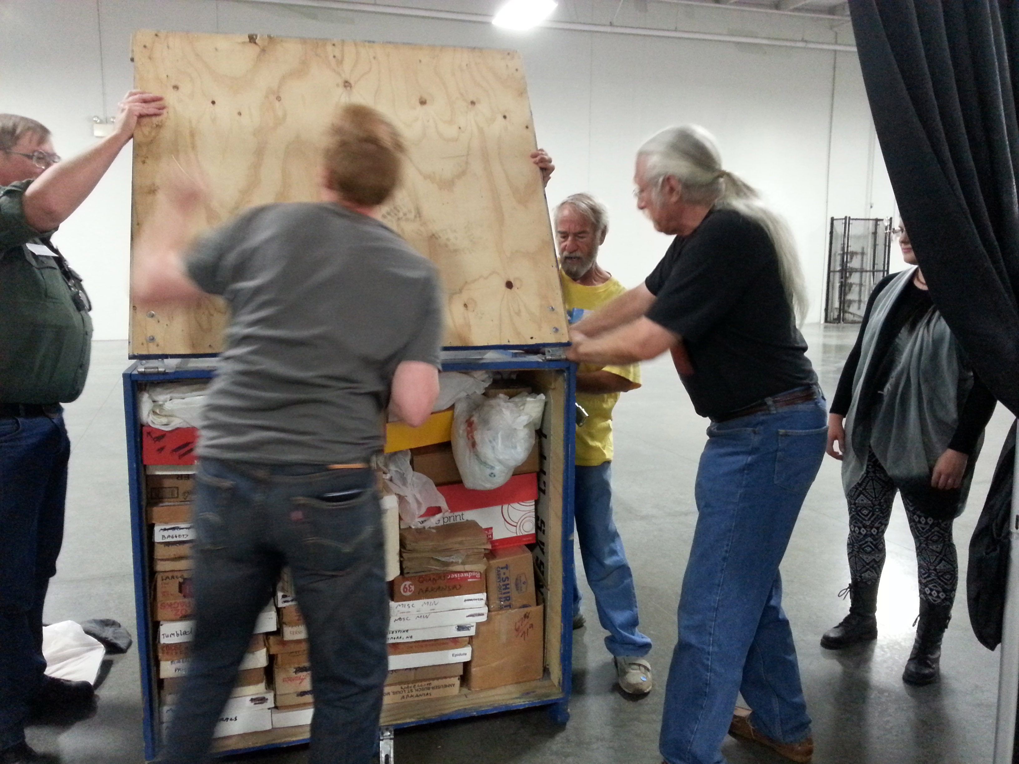 men packing items for storage