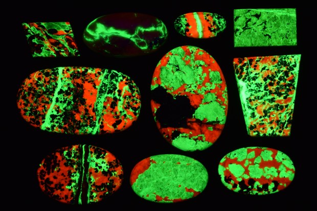 Franklinite Cabochons under shortwave UV light.